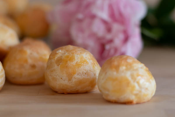 up close of gougères with a peonie