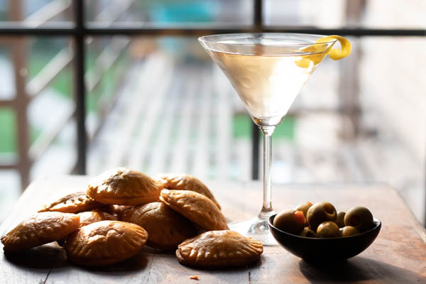 cheddar cheese pastries with a cocktail